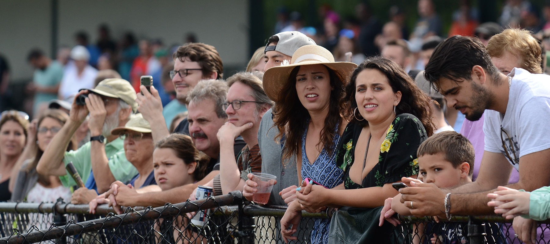 The crowd along the clubhouse rail at Suffolk Downs