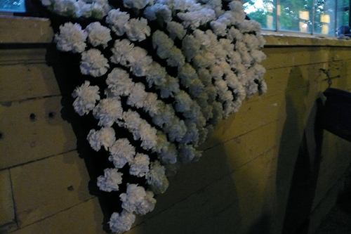 Blanket of Belmont carnations draped over a barn window sill