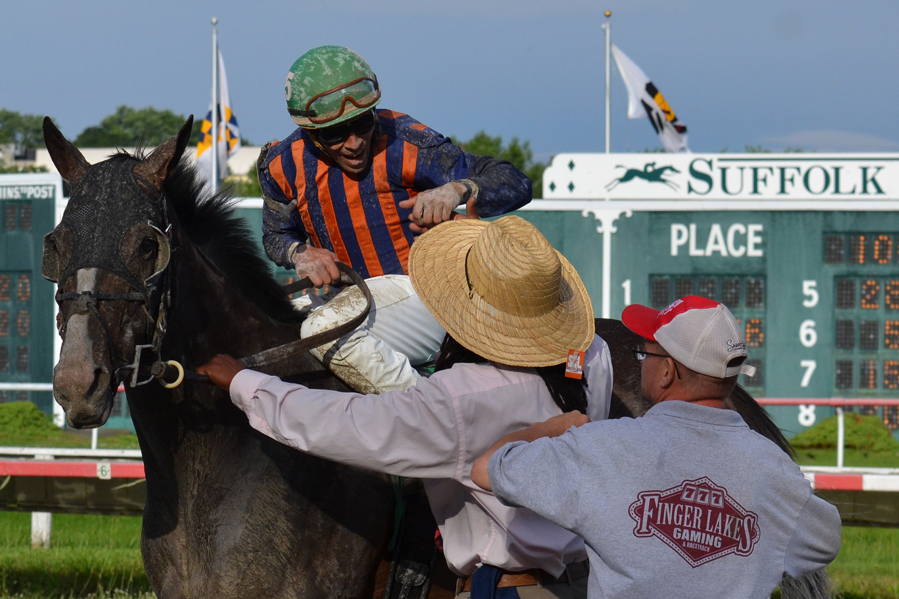 The connections celebrate as Catauga County returns to the winner's circle