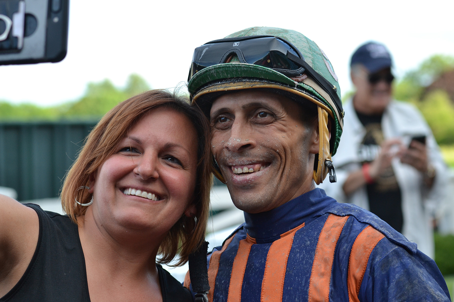 Andy Hernandez Sanchez takes selfies with well-wishers after he wins the last race at Suffolk Downs